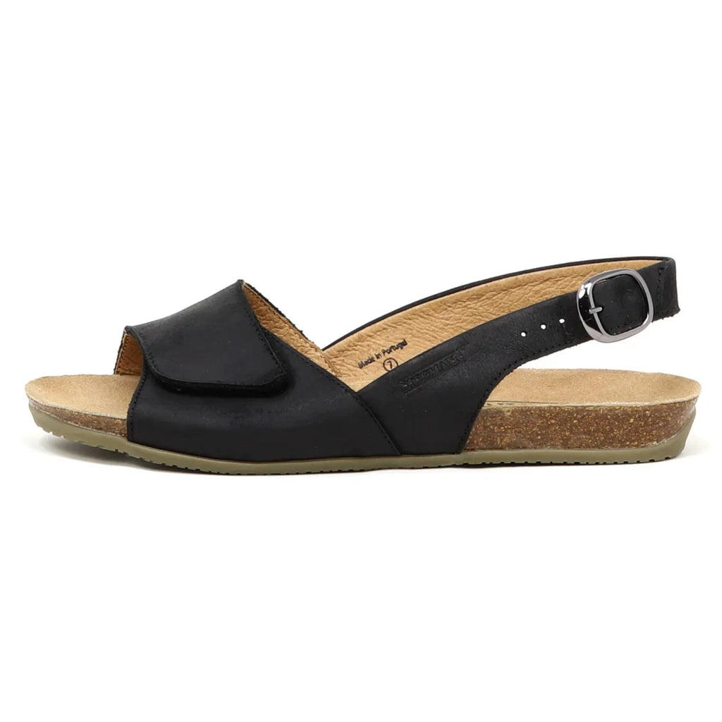 Side view of the Women's 'Clara' Slingback Sandal in black, featuring an open toe, adjustable buckle strap, supportive cork footbed, and contoured design.