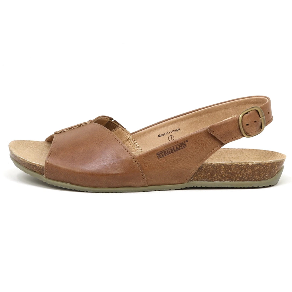 The Women's Louisa Leather Slingback Sandal is a brown leather sandal featuring an open toe, a slingback strap with a small buckle, cork sole, and padded arch support for comfort.